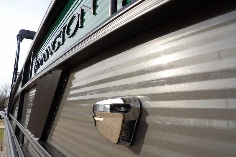 Slide: The Image of 2026 Bennington M Quad Bench 22 MFB, close-up of sleek exterior design. - 42