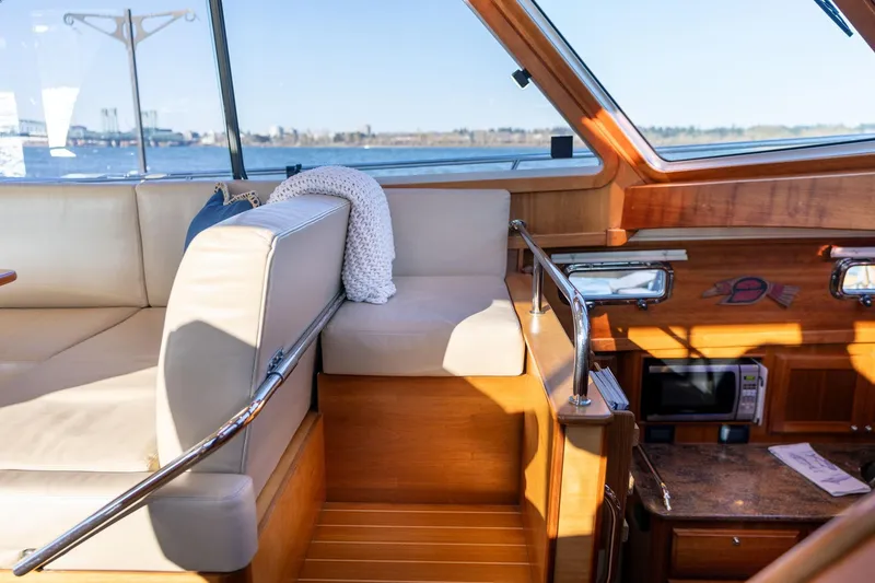 Slide: The Image of Interior of 2013 Sabre 38 Salon Express with beige seating and wooden accents. - 11