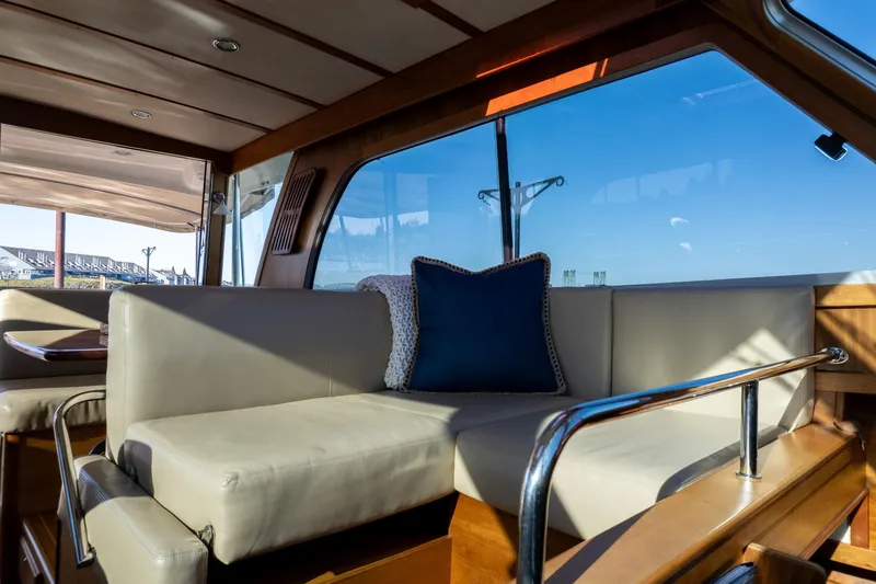 Slide: The Image of Luxurious interior of 2013 Sabre 38 Salon Express yacht with plush seating and blue cushion. - 12