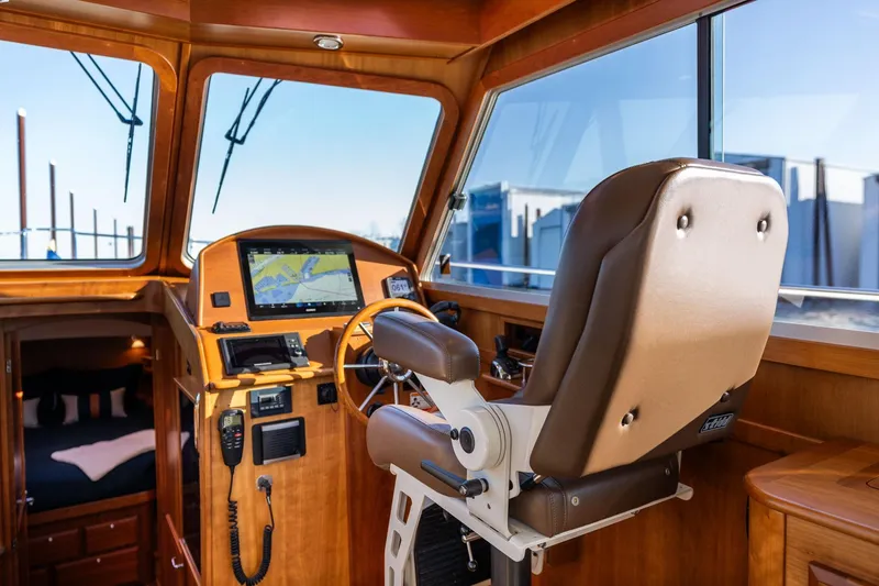Slide: The Image of Interior of 2013 Sabre 38 Salon Express yacht with helm, navigation equipment, and captain's chair. - 13
