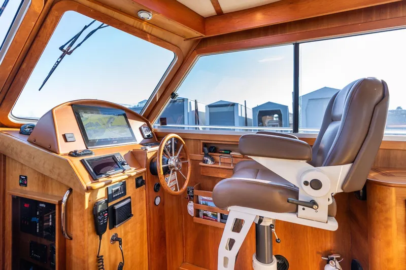 Slide: The Image of 2013 Sabre 38 Salon Express helm with navigation system and captain's chair. - 14