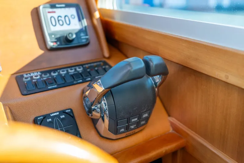 Slide: The Image of Control panel of 2013 Sabre 38 Salon Express yacht with throttle and navigation display. - 18
