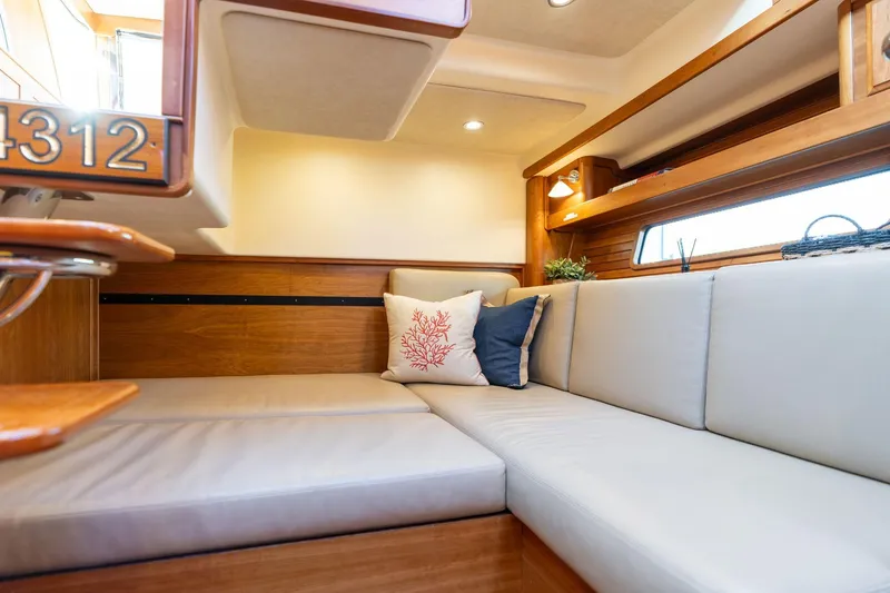 Slide: The Image of 2013 Sabre 38 Salon Express interior with cozy seating and elegant wood finish. - 31