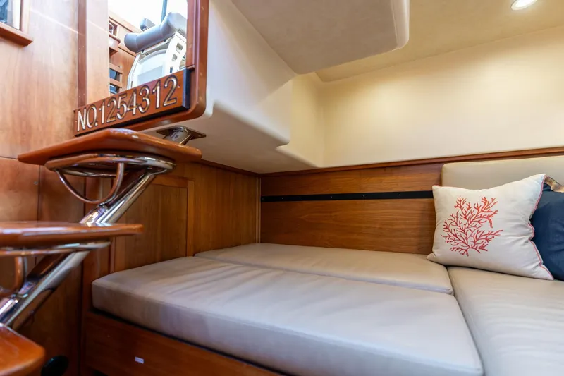 Slide: The Image of 2013 Sabre 38 Salon Express interior with cozy seating and decorative pillow. - 32