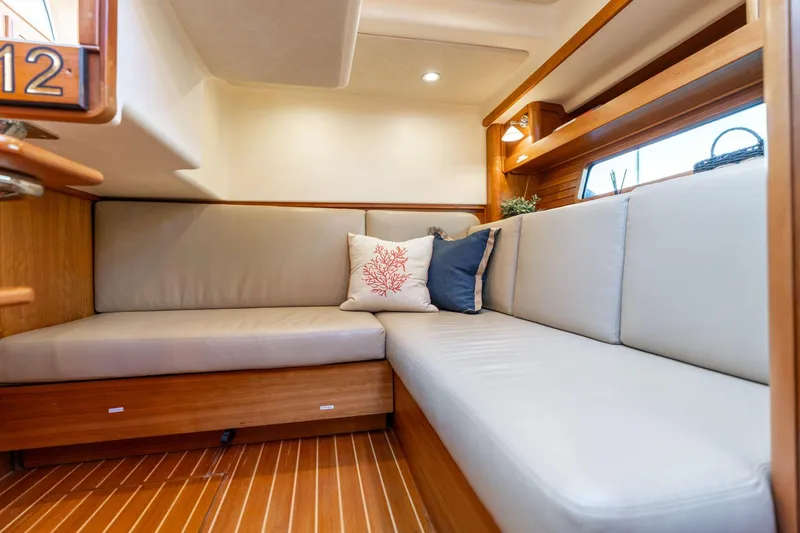 Slide: The Image of 2013 Sabre 38 Salon Express interior with cozy seating and decorative pillows. - 33