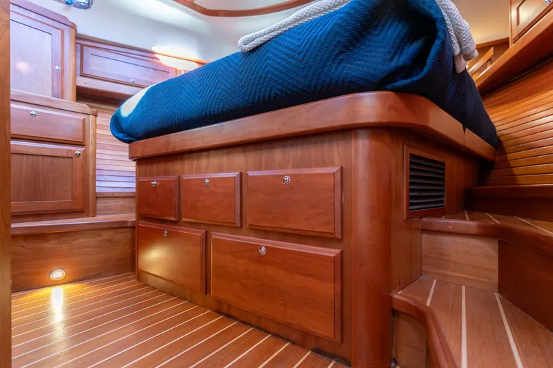 Slide: The Image of 2013 Sabre 38 Salon Express cabin interior with wooden cabinetry and bed. - 41