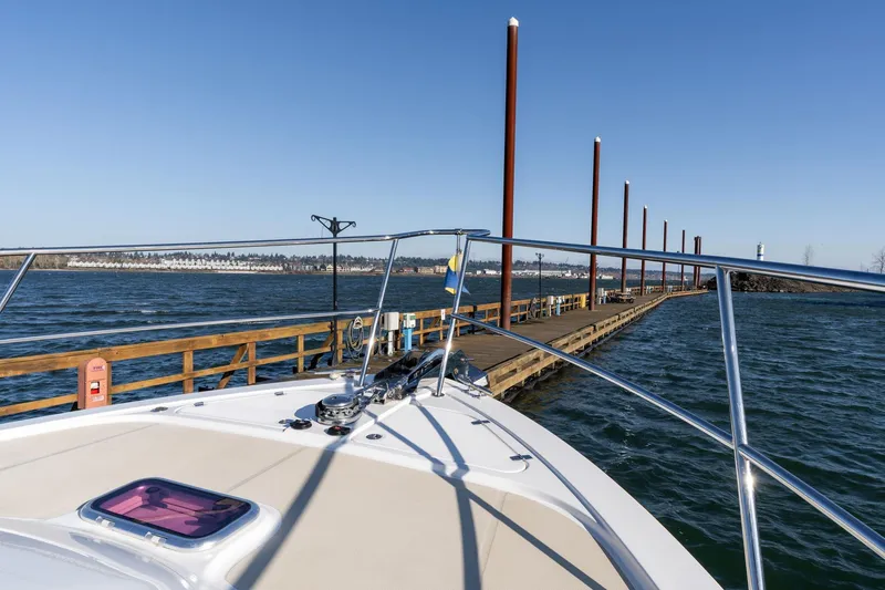 Slide: The Image of 2013 Sabre 38 Salon Express at dock, calm waters, clear sky, scenic view. - 54