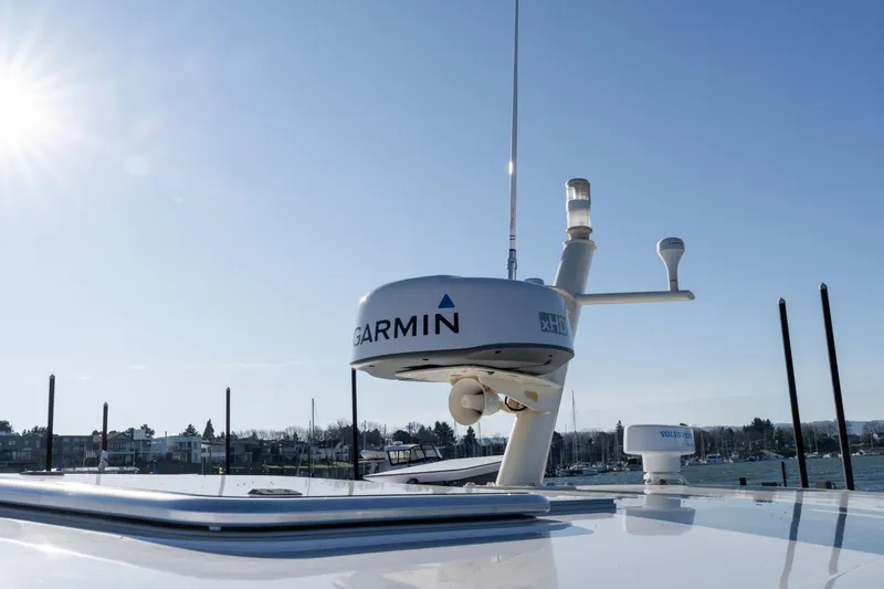 Slide: The Image of 2013 Sabre 38 Salon Express with Garmin radar under clear blue sky. - 59