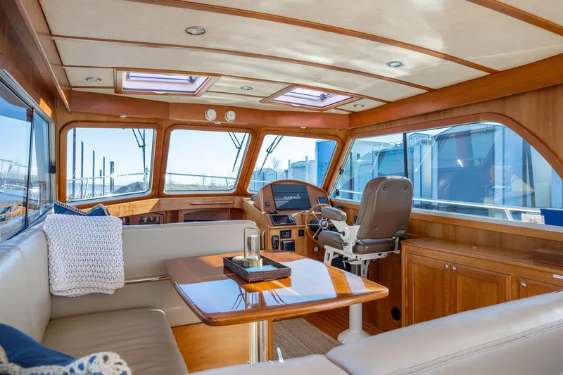 Slide: The Image of Interior of 2013 Sabre 38 Salon Express yacht with luxurious seating and helm. - 7