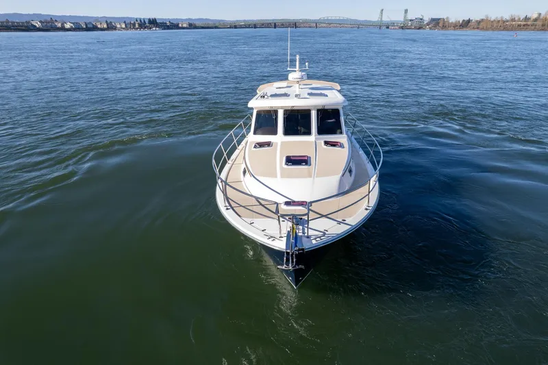 Slide: The Image of 2013 Sabre 38 Salon Express yacht cruising on open water. - 70