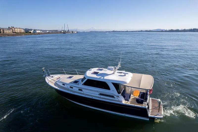 Slide: The Image of 2013 Sabre 38 Salon Express yacht cruising on a sunny day in open waters. - 72