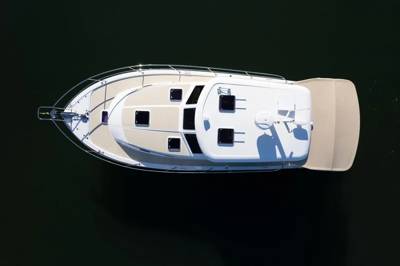Slide: The Image of Overhead view of 2013 Sabre 38 Salon Express yacht on dark water. - 80