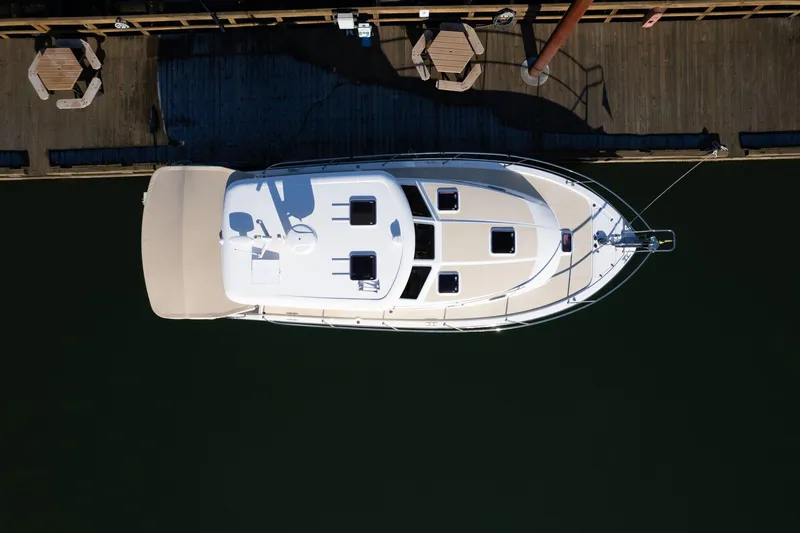 Slide: The Image of Aerial view of 2013 Sabre 38 Salon Express yacht docked at a wooden pier. - 81