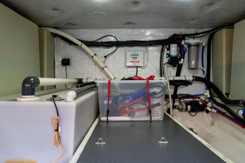 Slide: The Image of Engine room of 2013 Sabre 38 Salon Express with organized equipment and storage. - 94