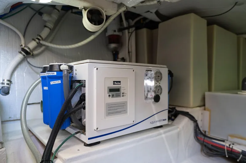 Slide: The Image of Engine room of 2013 Sabre 38 Salon Express with water filtration system. - 96