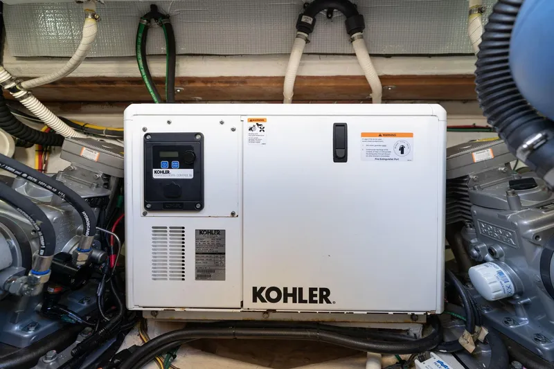 Slide: The Image of Engine room of 2013 Sabre 38 Salon Express with Kohler generator. - 97