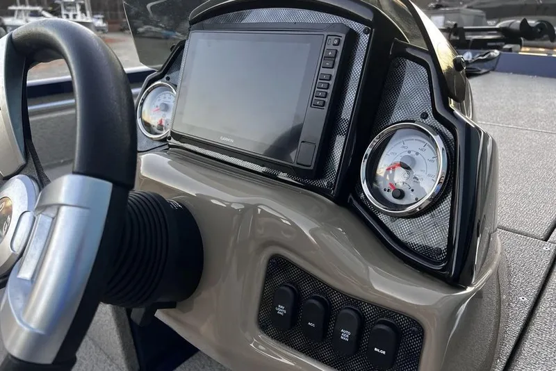 Slide: The Image of Dashboard of 2023 G3 Sportsman 1710 boat with steering wheel and digital display. - 10