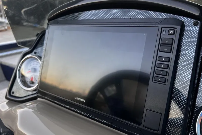 Slide: The Image of Garmin display on 2023 G3 Sportsman 1710 boat dashboard, featuring control buttons. - 12