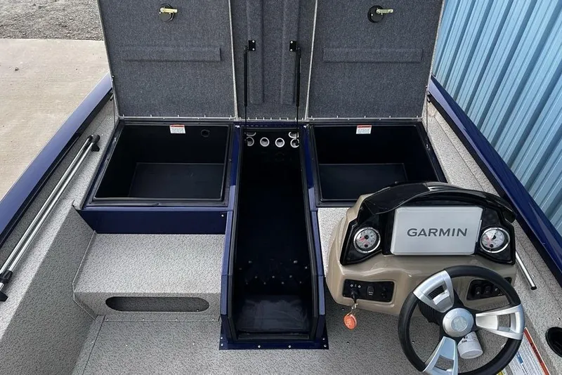 Slide: The Image of 2023 G3 Sportsman 1710 boat interior with Garmin dashboard and storage compartments. - 13