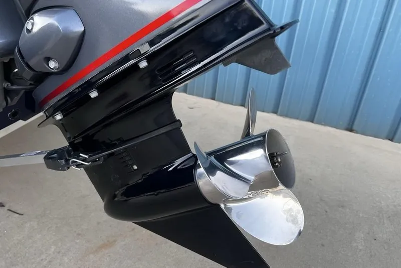 Slide: The Image of 2023 G3 Sportsman 1710 boat motor with shiny propeller, blue background. - 15