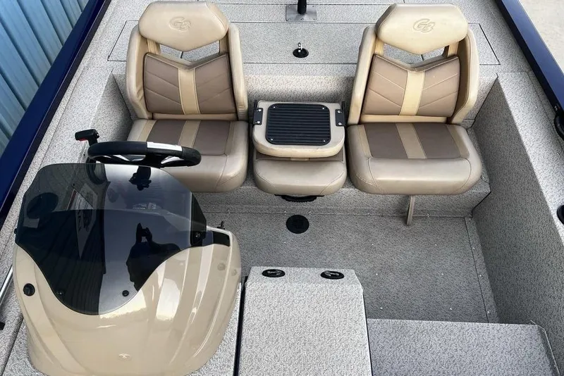 Slide: The Image of 2023 G3 Sportsman 1710 boat interior with dual seats and steering console. - 17
