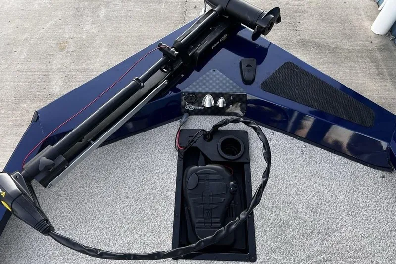 Slide: The Image of 2023 G3 Sportsman 1710 boat deck with trolling motor and control panel. - 19