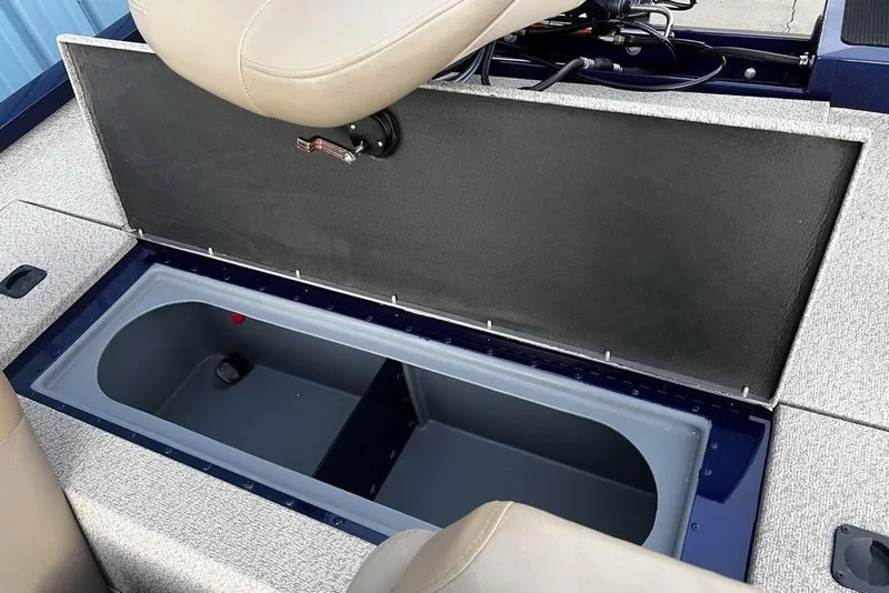 Slide: The Image of 2023 G3 Sportsman 1710 boat storage compartment with open lid and seating. - 20