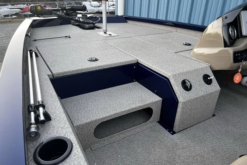 Slide: The Image of 2023 G3 Sportsman 1710 boat interior with fishing rod holders and control panel. - 8