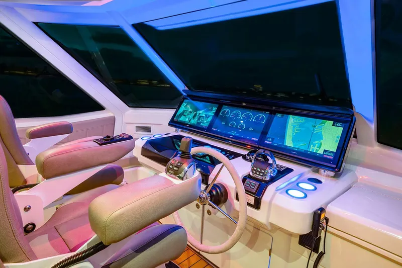 Slide: The Image of Manufacturer Provided Image: Cockpit of 2026 Aquila 70 Luxury yacht with advanced navigation systems and controls. - 11