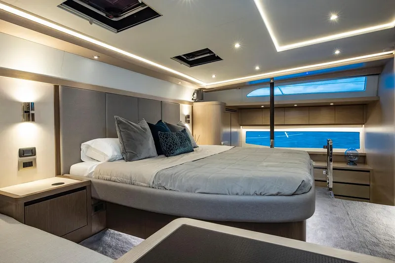 Slide: The Image of Manufacturer Provided Image: Luxurious bedroom interior of 2026 Aquila 70 Luxury yacht with ocean view. - 13