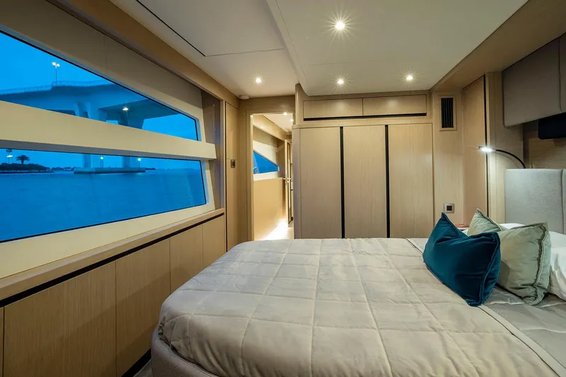 Slide: The Image of Manufacturer Provided Image: Luxurious bedroom interior of 2026 Aquila 70 Luxury yacht with modern design and large windows. - 14
