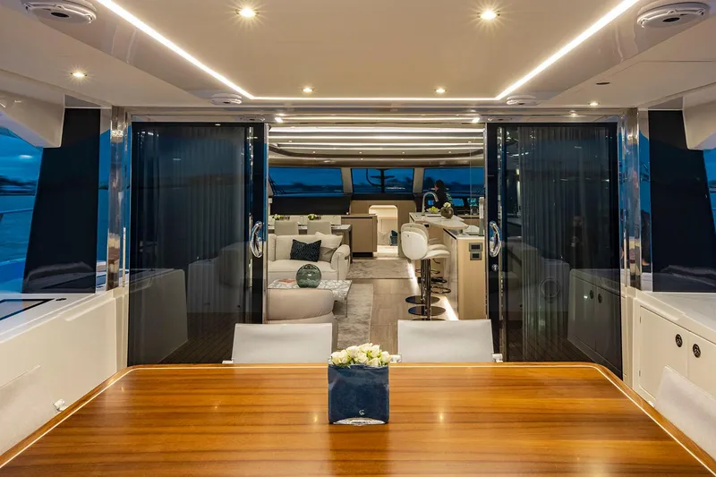 Slide: The Image of Manufacturer Provided Image: Luxurious interior of 2026 Aquila 70 yacht with elegant dining and lounge areas. - 7