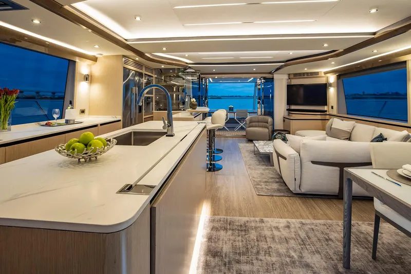 Slide: The Image of Manufacturer Provided Image: Luxurious interior of 2026 Aquila 70 yacht with modern kitchen and elegant seating area. - 9