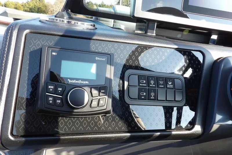 Slide: The Image of Control panel of 2026 Bennington M Quad Bench 22 MFB with Rockford Fosgate audio system. - 22