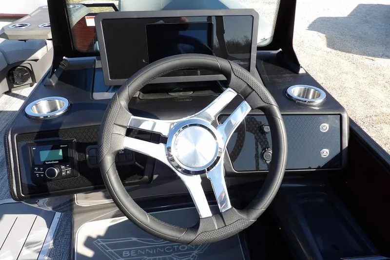 Slide: The Image of Steering console of 2026 Bennington M Quad Bench 22 MFB with modern controls. - 27