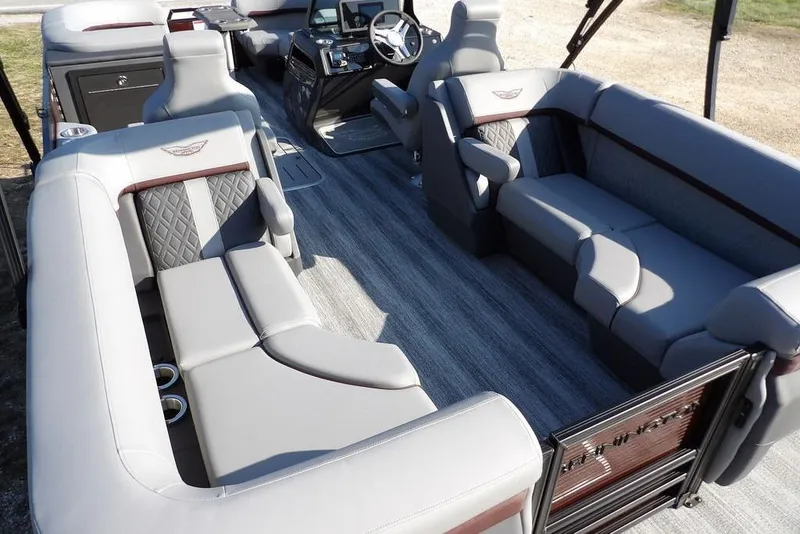 Slide: The Image of Luxurious interior of 2026 Bennington M Quad Bench 22 MFB pontoon boat. - 28