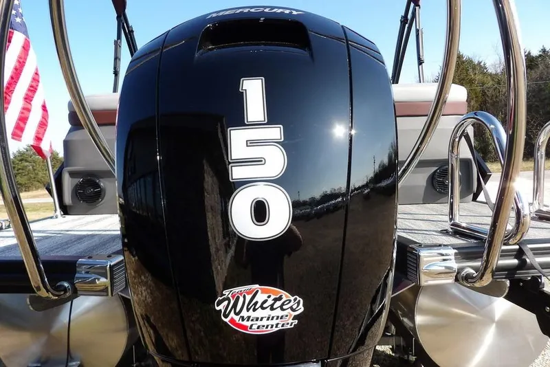 Slide: The Image of 2026 Bennington M Quad Bench 22 MFB with Mercury 150 engine, American flag visible. - 35