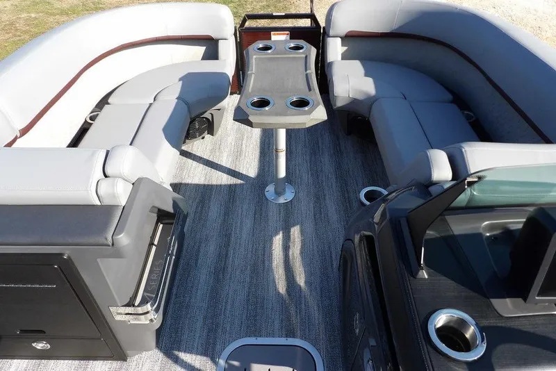 Slide: The Image of 2026 Bennington M Quad Bench 22 MFB interior with gray seating and central table. - 8