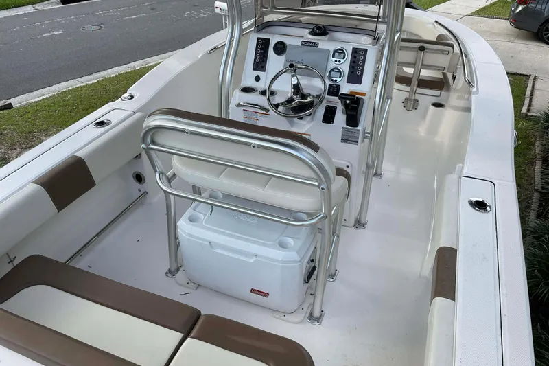 Slide: The Image of 2017 Robalo R200ES boat interior with steering console and seating. - 5
