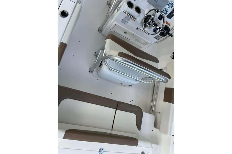 Slide: The Image of 2017 Robalo R200ES boat interior with steering console and seating. - 8