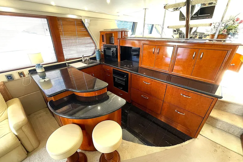 Slide: The Image of GALLEY FORWARD TO PORT WITH U-SHAPED WRAP AROUND COUNTERTOPS & CABINETRY - 15