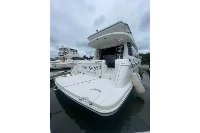 Slide: The Image of 2004 CARVER 570 VOYAGER "SEA SPIRIT" TRANSOM VIEW - 3