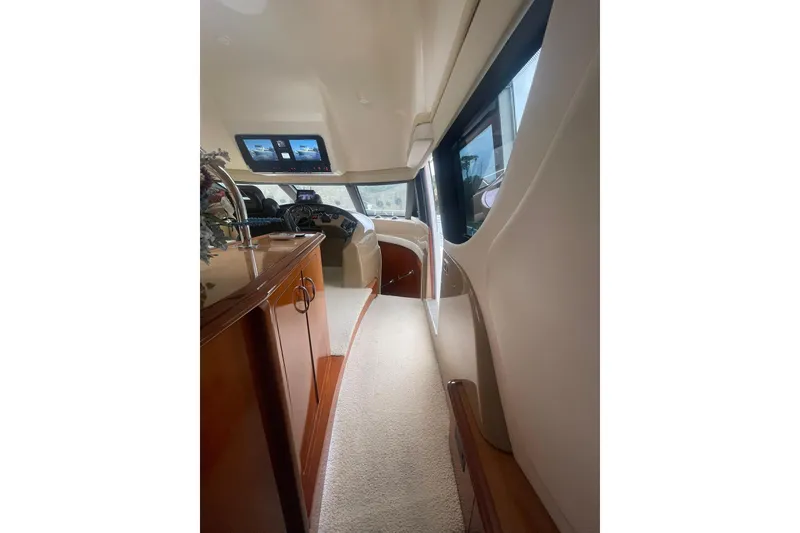 Slide: The Image of COMPANIONWAY FORWARD FROM THE SALON TO THE PILOTHOUSE & DOWN TO THE THREE STATEROOMS AND TWO FULL HEADS WITH SHOWERS - 31