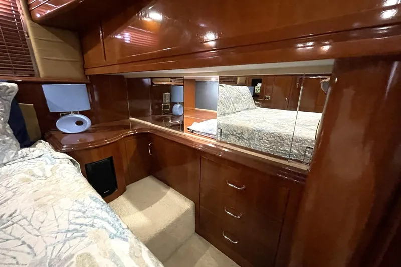 Slide: The Image of CUSTOM MIRRORED HIDDEN STORAGE VANITY AREA AFT OF MASTER BED - 39