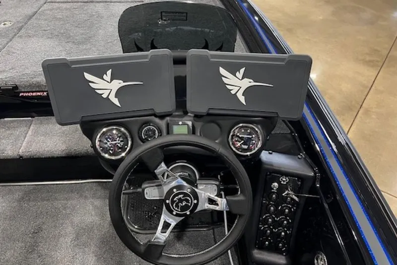 Slide: The Image of 2026 Phoenix 919 ZXL boat dashboard with dual screens and steering wheel. - 12