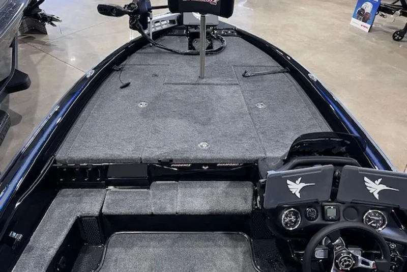 Slide: The Image of 2026 Phoenix 919 ZXL boat interior with steering console and spacious deck. - 13