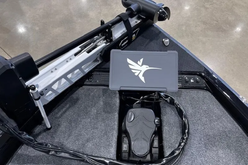 Slide: The Image of 2026 Phoenix 919 ZXL boat deck with control panel and foot pedal. - 2