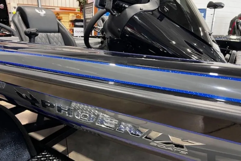 Slide: The Image of 2026 Phoenix 919 ZXL boat with sleek design and blue accents on display. - 3