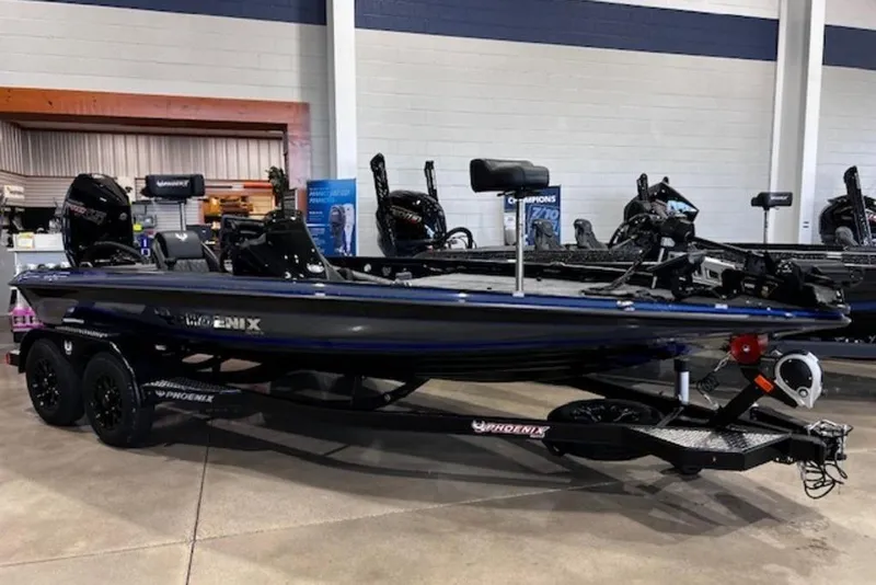 Slide: The Image of 2026 Phoenix 919 ZXL boat on display in showroom, featuring sleek design and dual motors. - 8