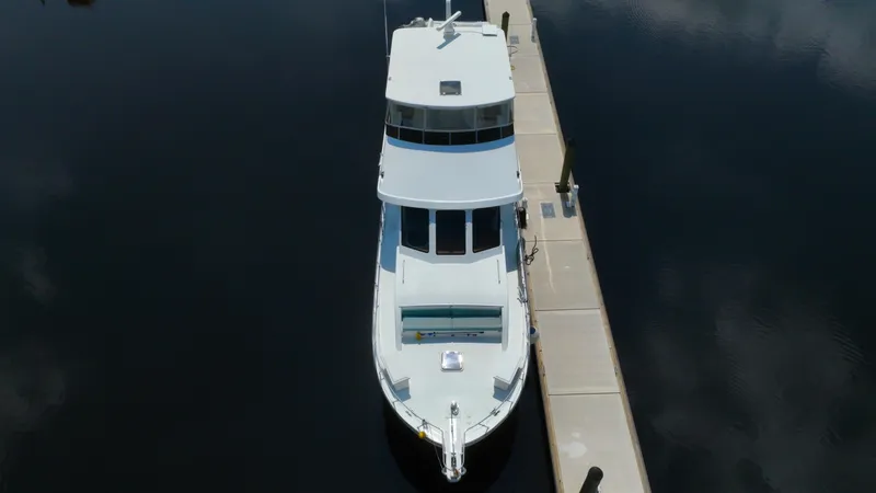 Slide: The Image of Aerial view of 2005 Jefferson Marquessa 60 MY yacht docked at a marina. - 11